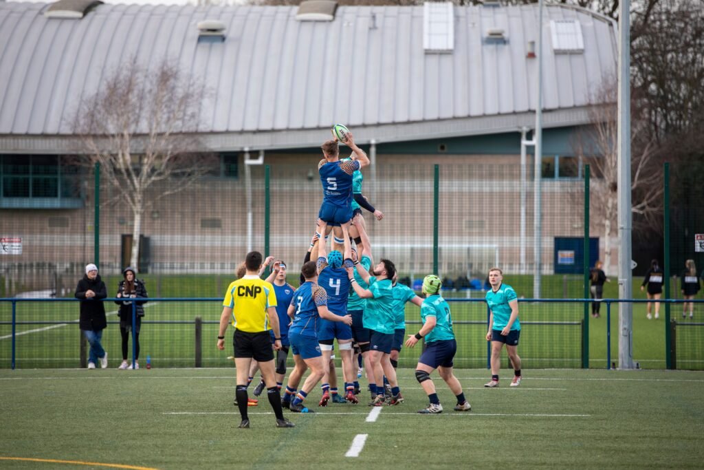 outdoor-image-02 Exciting rugby lineout action at a sports field in Manchester, England.